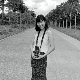 A person standing on a road

Description automatically generated with low confidence
